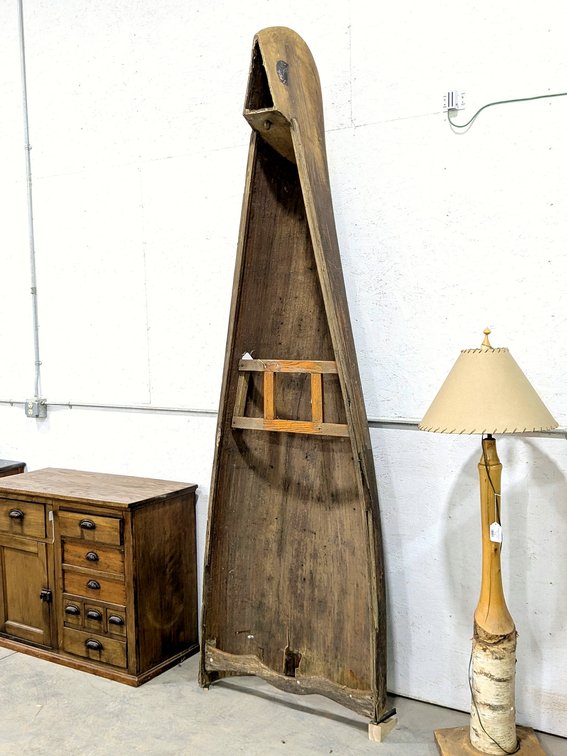 Vintage wooden canoe has been repurposed and is 9' tall - add some shelves for a unique display.
