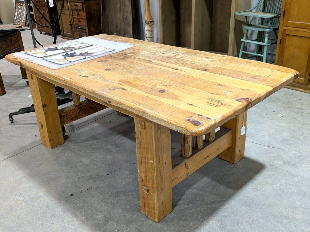 Rustic wooden dining table measures 79" long x 42" wide x 30" high.  Table legs are in need of repai