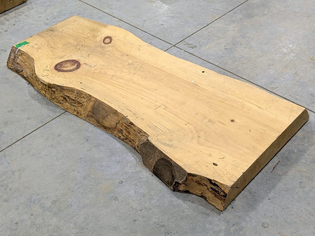 Double sided live edge pine slab measures 40" x 16" x 2-1/2" thick.