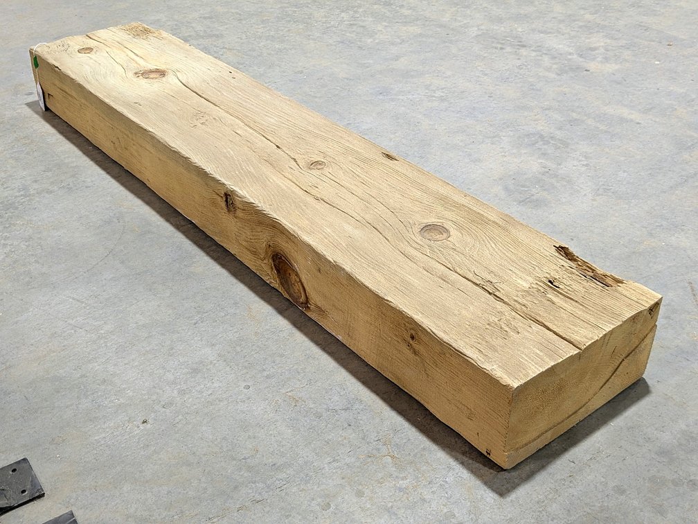 Rustic wooden beam measures 12" x 6" thick x 63" long.