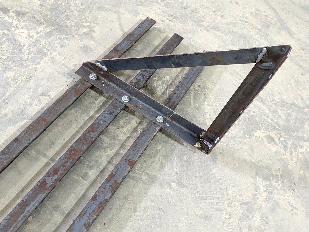Heavy duty steel shelf measures 10' long and 12" wide.