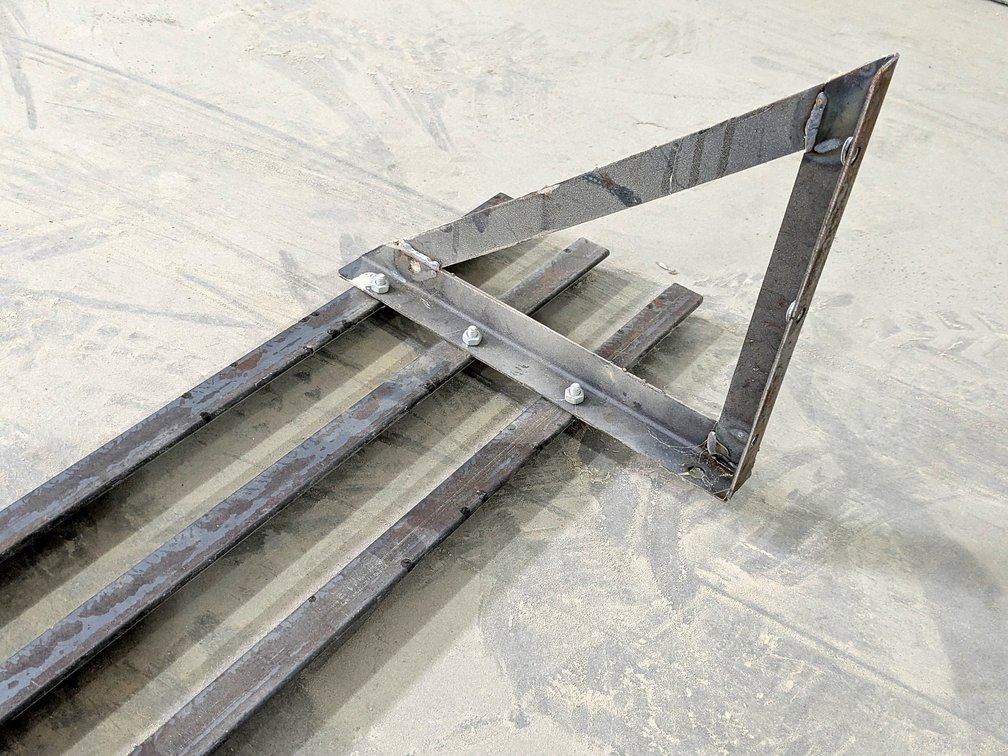 Heavy duty steel shelf measures 10' long and 12" wide.