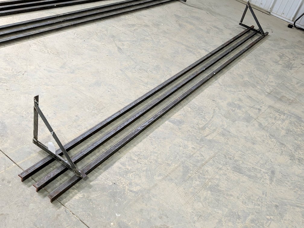 Heavy duty steel shelf measures 10' long and 12" wide.