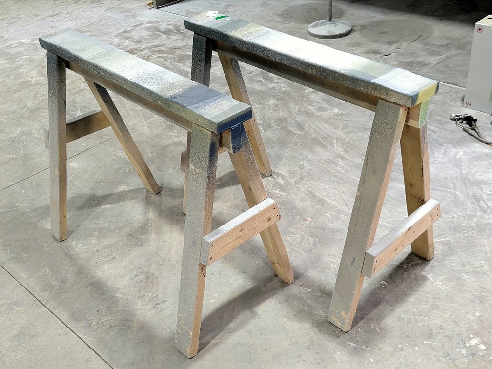Pair of sturdy wooden saw horses are 45" wide x 35" tall.
