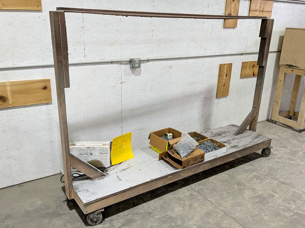 Rolling painting rack measures 101" x 68" tall.