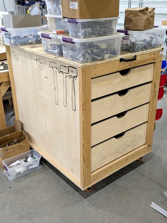 Rolling work bench / organizer is 3' x 4' and 46" tall.  Does not come with hardware or bins.