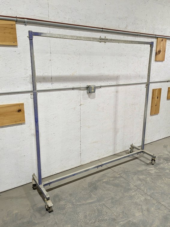 Rolling painting stand measures 68" wide x 71" tall.