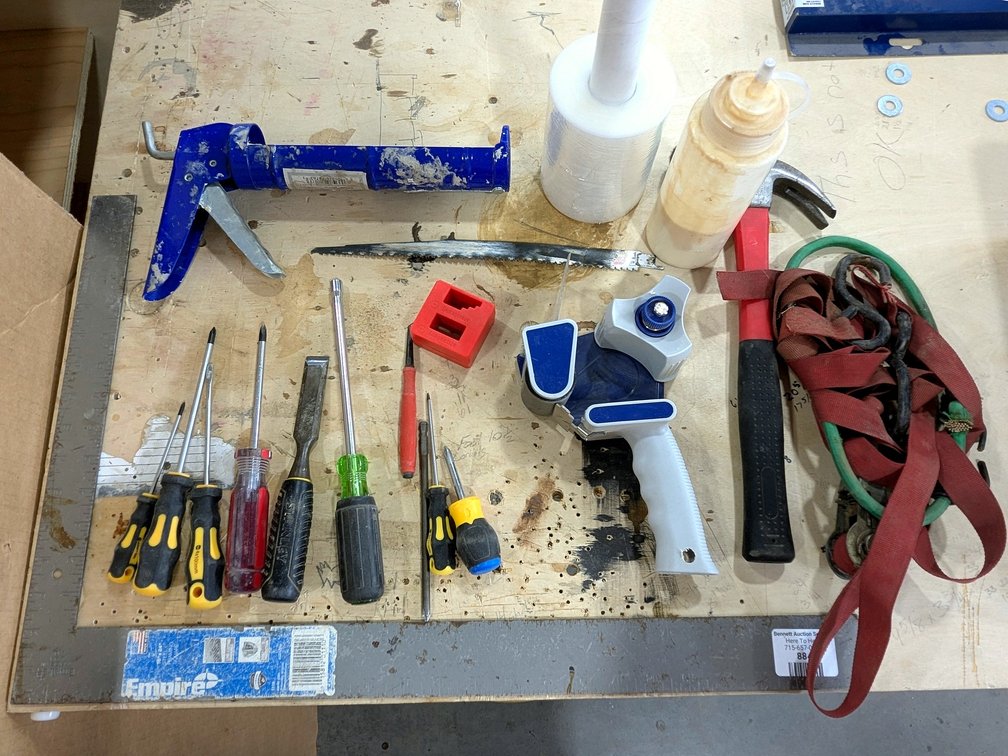 Empire framing square, hammer, tape gun, stretch wrap, screwdrivers and more.