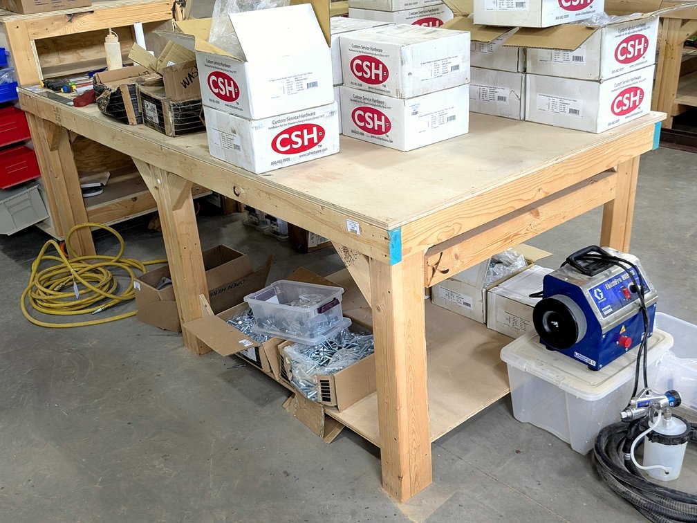 Sturdy work bench measures 4' x 8' and 35" tall.