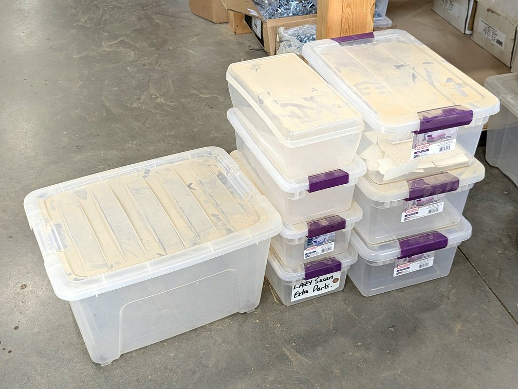 Eight storage totes with lids, largest is 18".