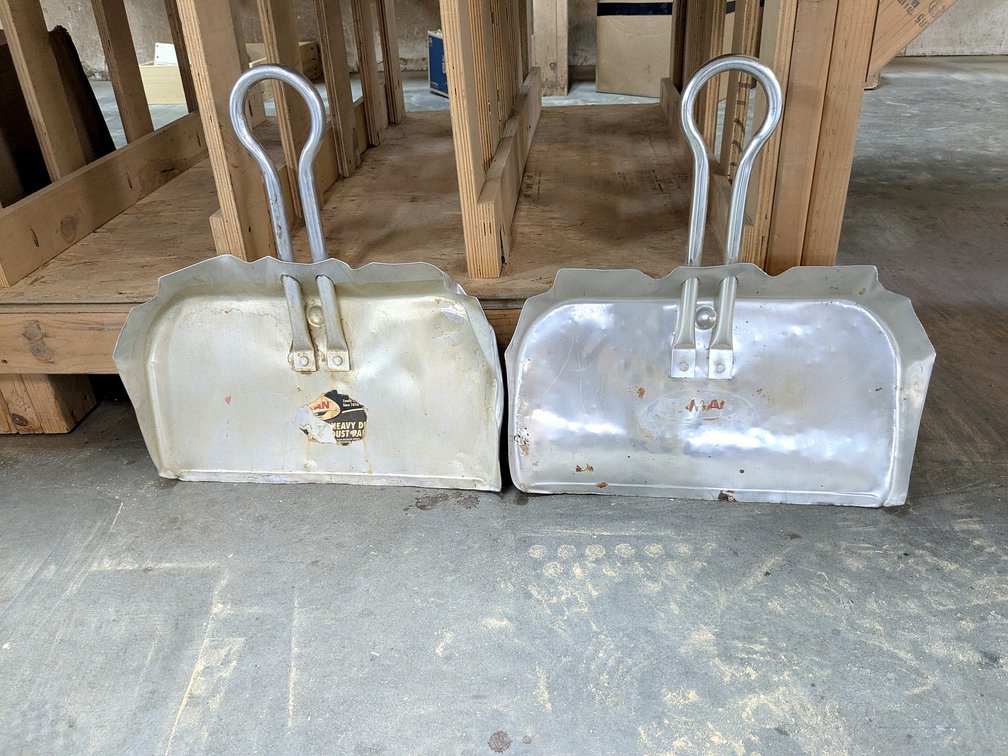 Two aluminum dust pans are 17" wide.