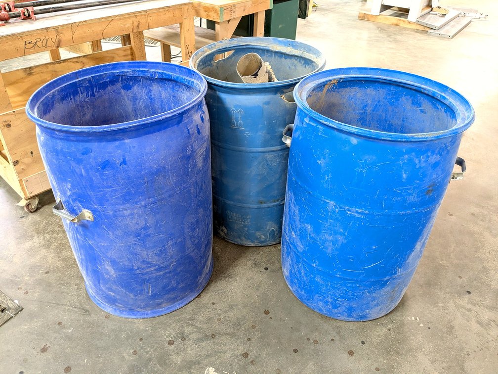Three trash cans are each about 3' tall.