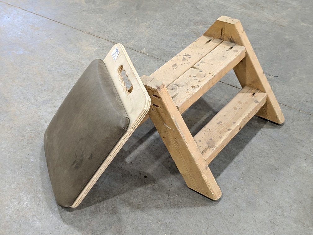 Handy little step stool is 14" tall overall and comes with a cushioned kneeling pad.
