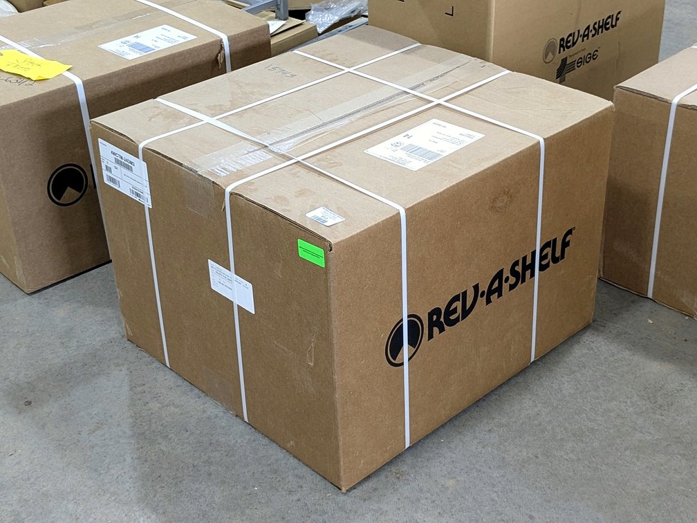 Rev-A-Shelf top mounting waste basket system for a 21" opening.  Google model number for specs.