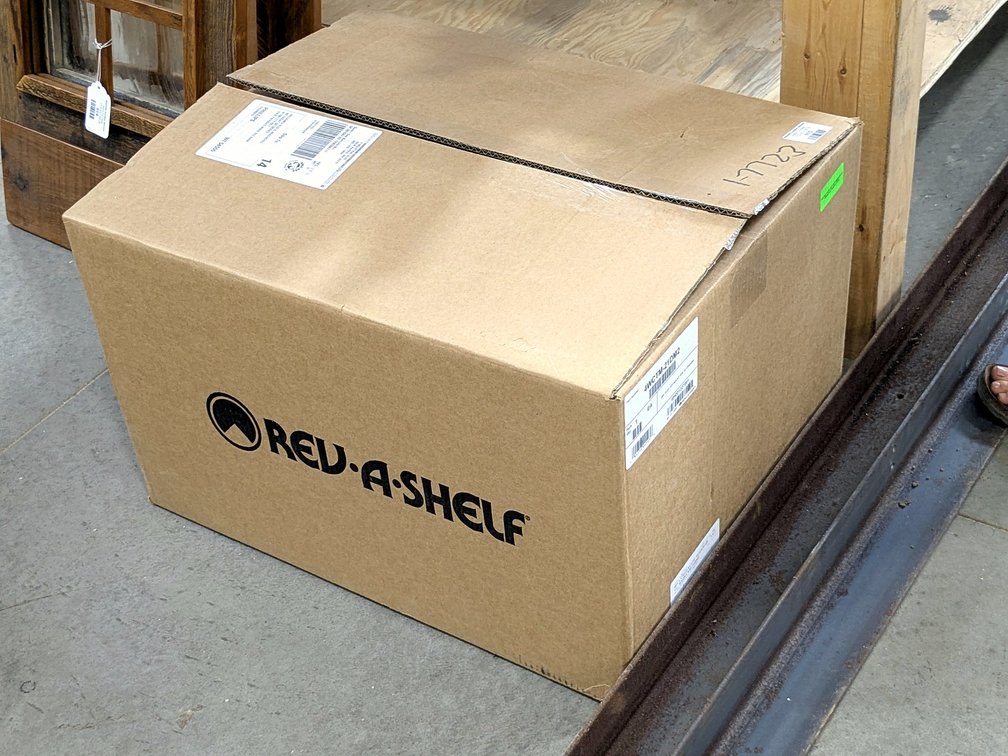 Rev-A-Shelf top mount waste basket system for an 18" opening.  Google model number for specs.