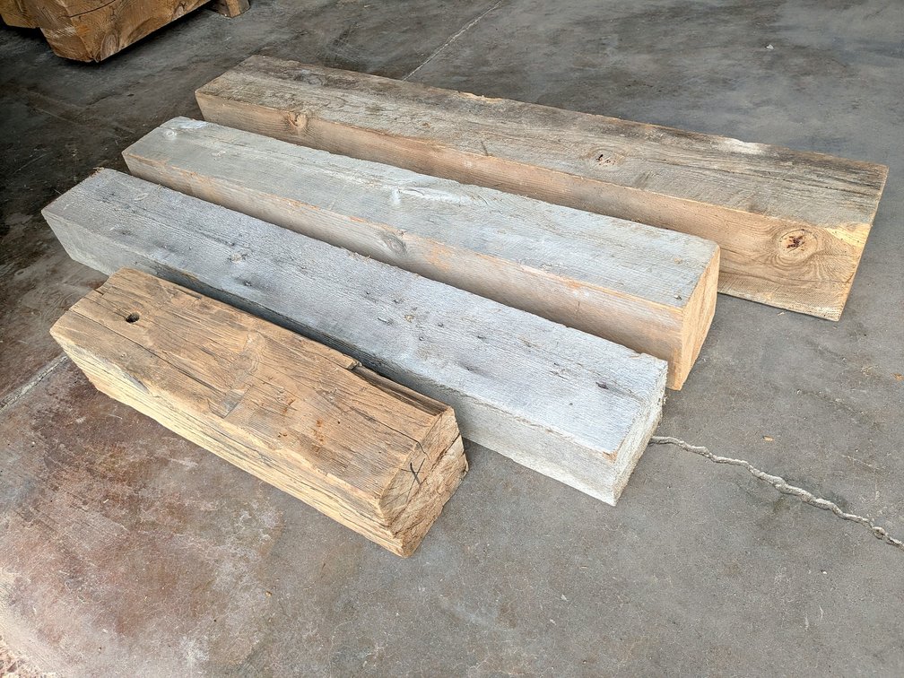 Four pieces of rustic barn beams up to 10" x 8" and 5-1/2' long.