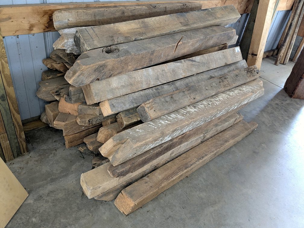 Reclaimed barn beams up to 4x4 and some 4x3, pile is nearly 5' wide.
