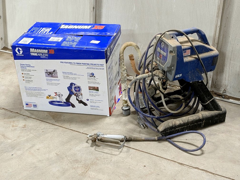 Graco Magnum X5 airless sprayer with box.