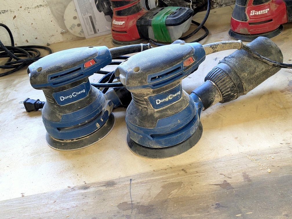 Two 5" random orbital palm sanders with good cords.