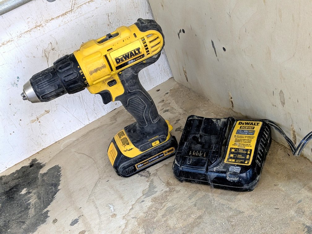 DeWalt 1/2" drill driver with charger is model DCD771.