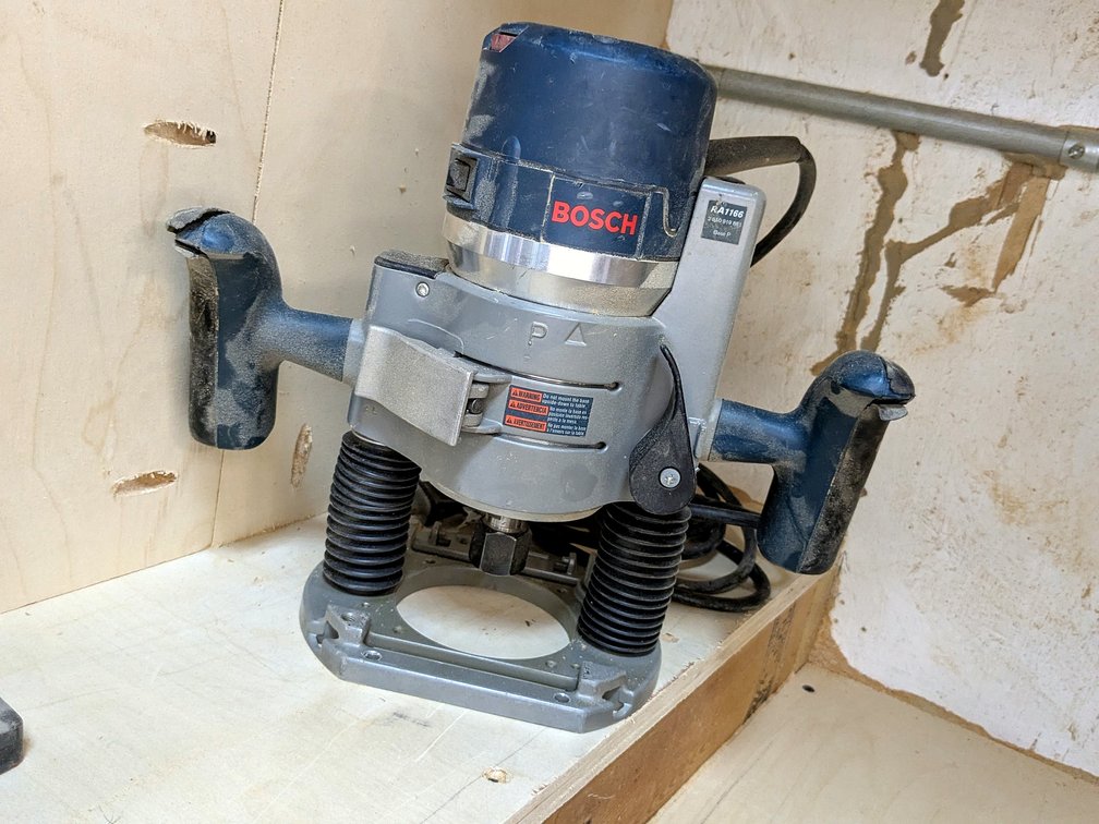 Bosch 1/2"  plunge router is 11" tall and model  RA1166.