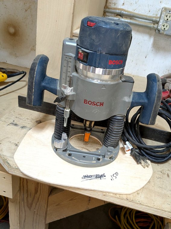 Bosch 1/2"  plunge router is 11" tall and model  RA1166.