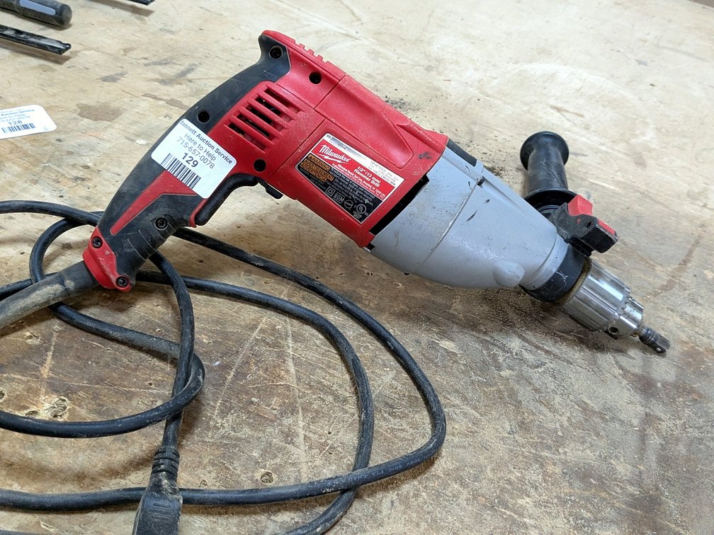 Milwaukee 1/2" hammer drill with positionable handle.
