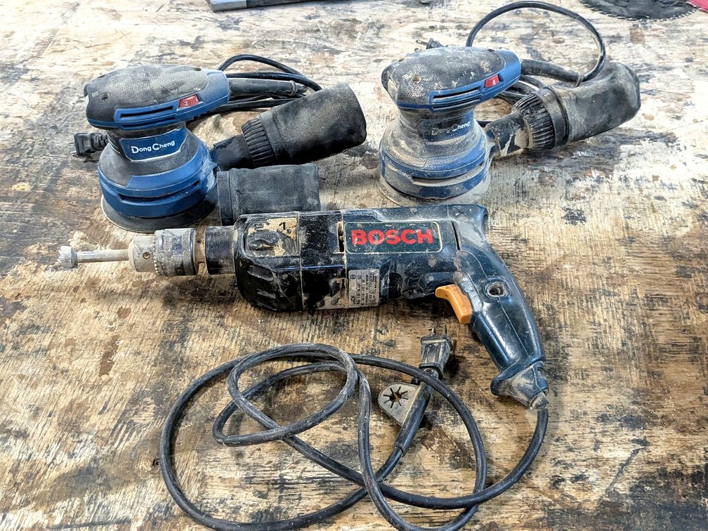 Bosch hammer drill with two speeds and reverse.  Drill has a 1/2" chuck and a 1" forstner bit.