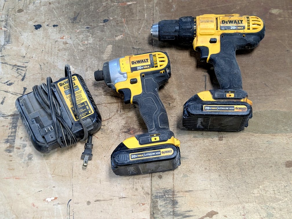DeWalt DCF885 impact driver and DeWalt DCD771 drill driver with charger.