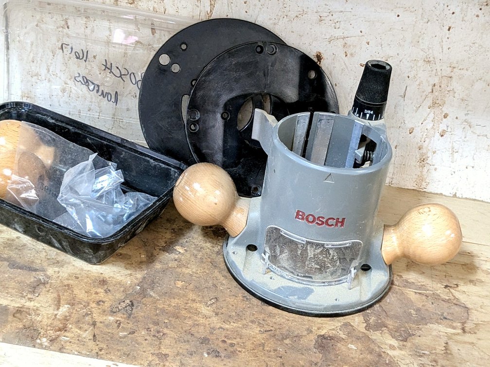 Bosch router base, plates, extra knobs, more. Base S is No. RA1161.