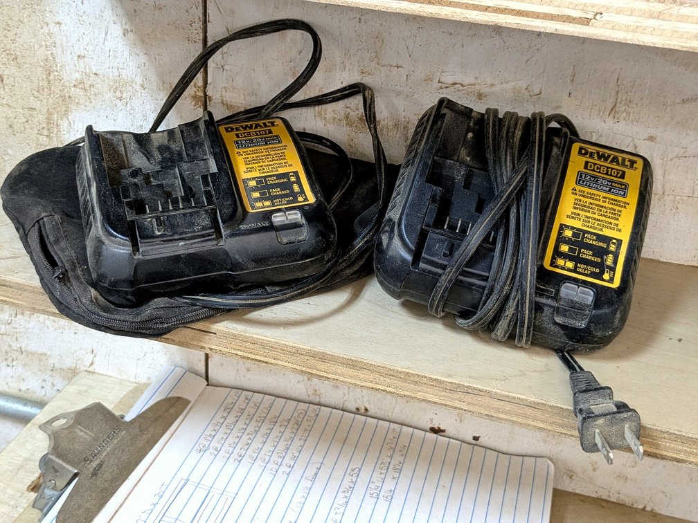 Two DeWalt 12v/20vMax battery chargers are model DCB107 and comes with a dust collector bag.