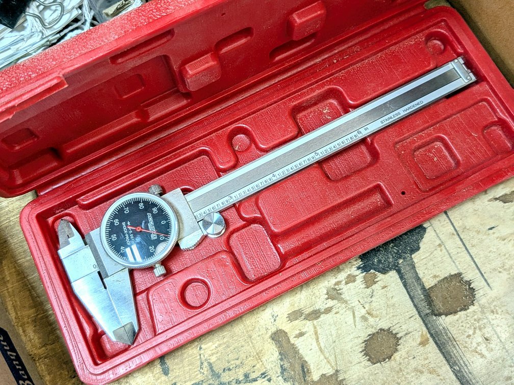 AccuSize caliper with case.