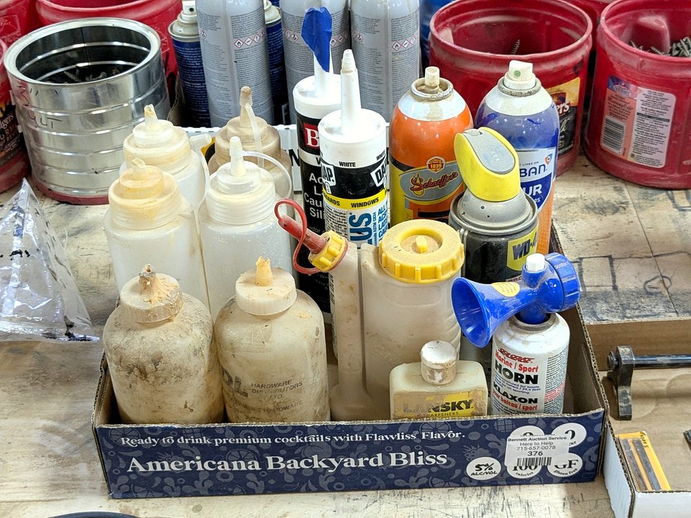 No shipping.  Partial cans of WD-40, glue, and more.