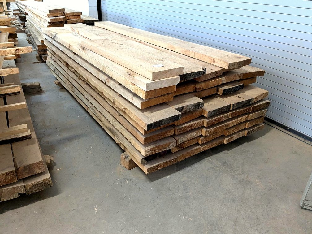 Rough sawn planks up to 10" wide and 2" thick and 9' long.
