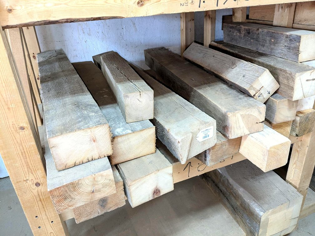 Rustic wooden posts up to 6" x 4" and 42" long.