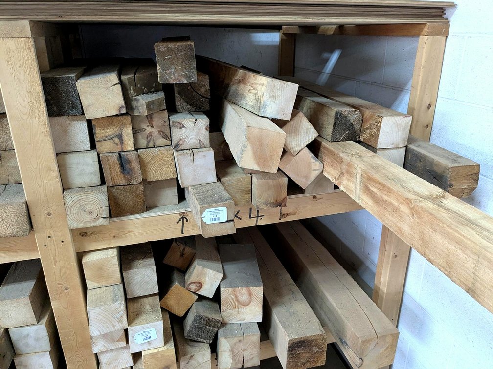 Rustic wooden posts up to 6" x 4" and 80" long.