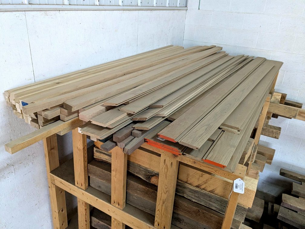 Oak or similar hardwood flooring, black walnut pieces, oak and more.  Longest is 9'.