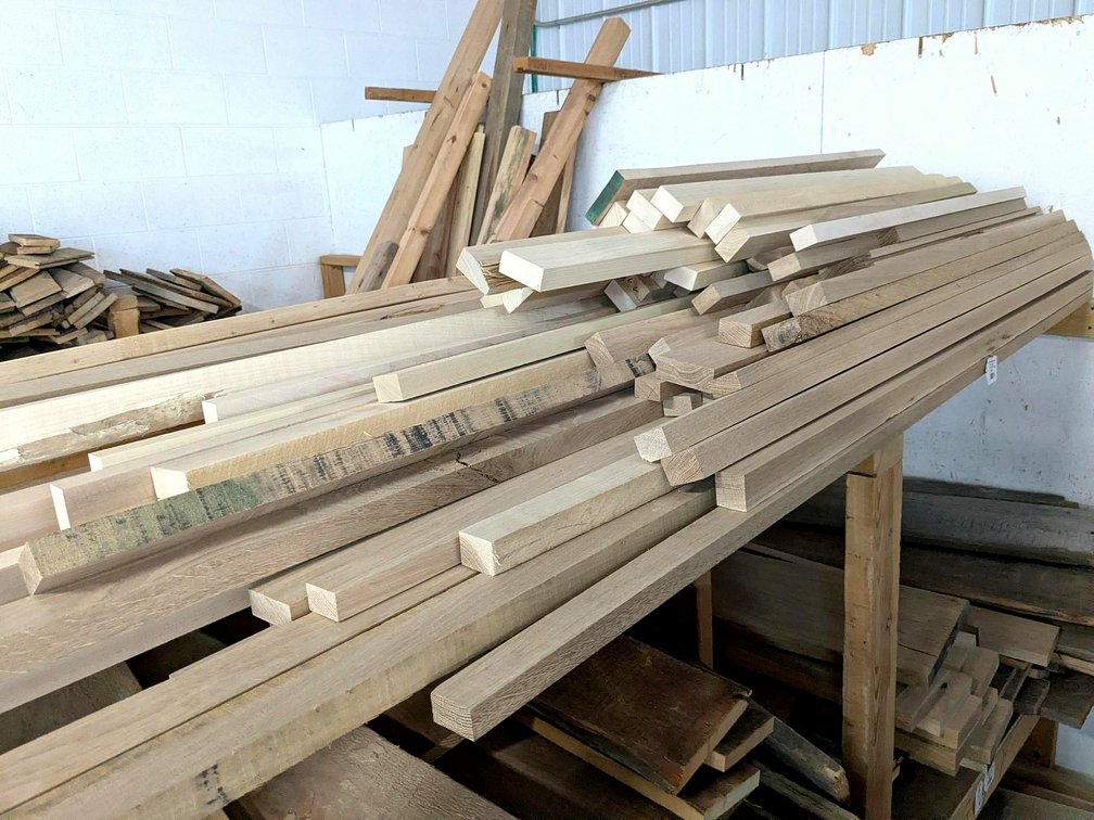 Oak, maple, and possibly other wood pieces up to 8' long.