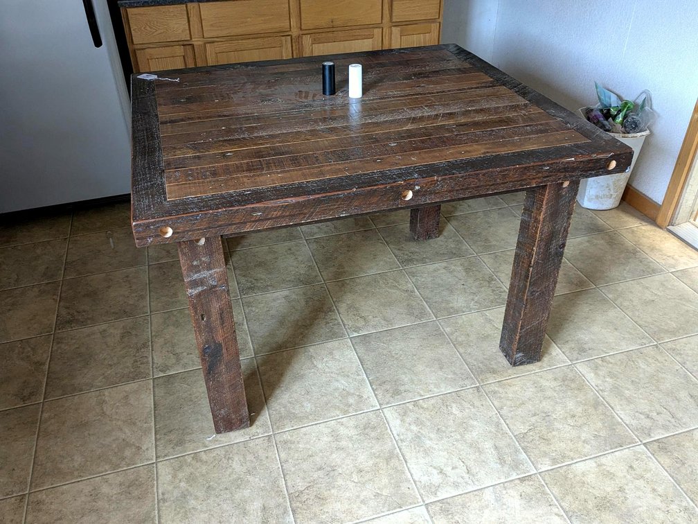 Rustic wooden table, measures 42" x 48".