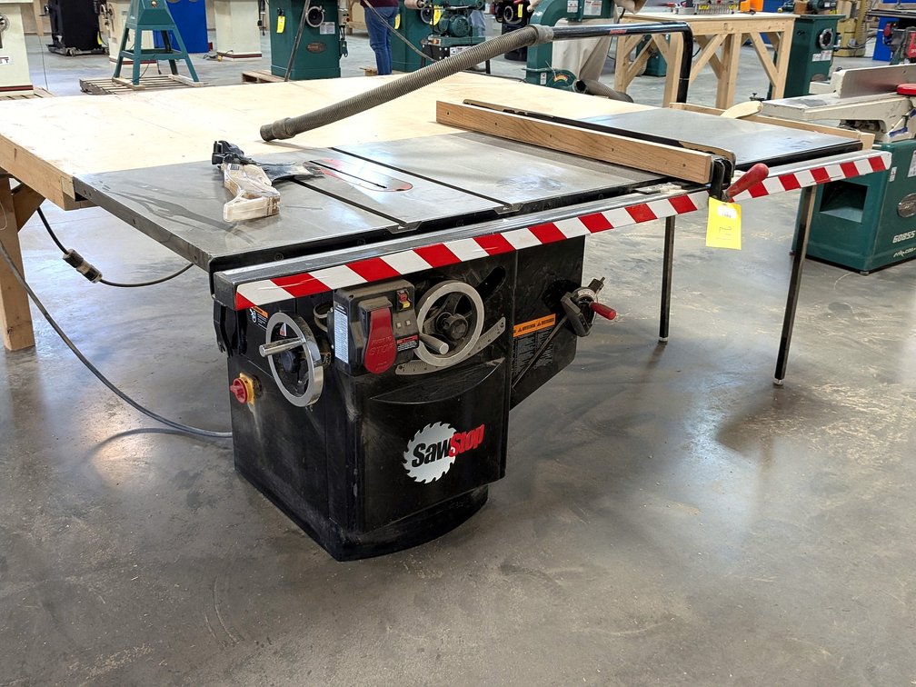 SawStop 10" industrial cabinet saw with a 230 volt single phase 3 hp motor; has a 7' table, 4' table