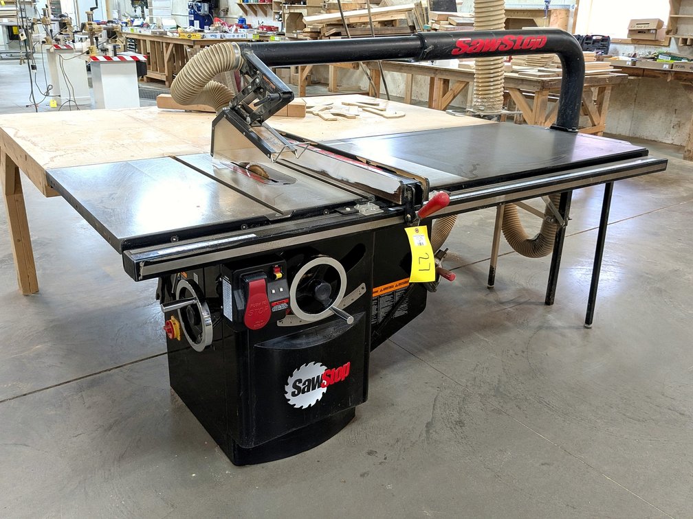 SawStop 10" industrial cabinet saw with a 230 volt single phase 3 hp motor; has a 7' table, 4' table