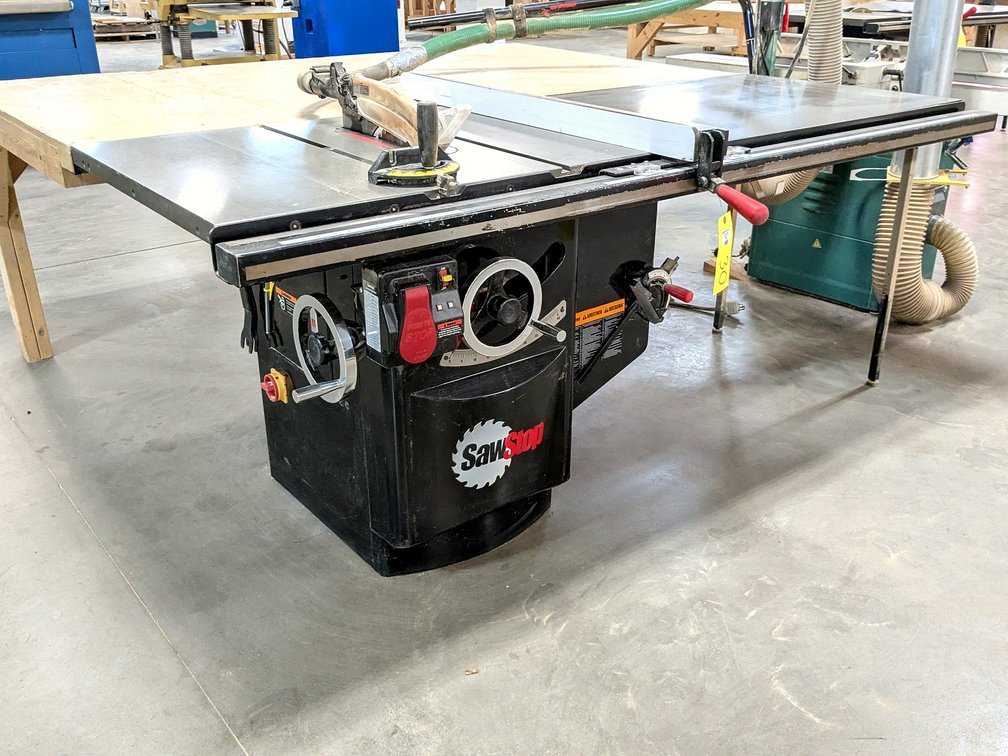 SawStop 10" industrial cabinet saw with a 230 volt single phase 3 hp motor; has a 7' table, 4' table