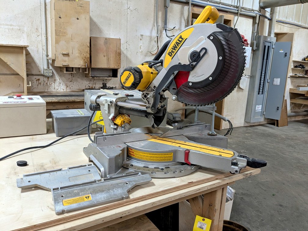 DeWalt DWS780 sliding compound miter saw with a 25" aluminum table and Diablo blade.