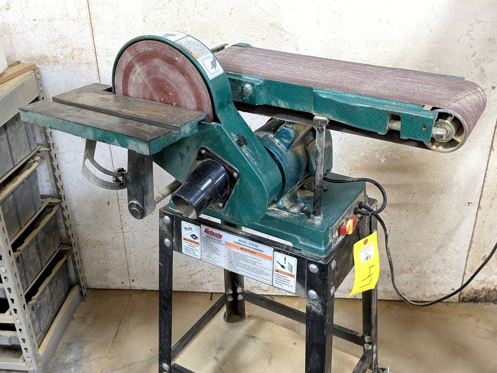 Grizzly combination sander with a 9" disc and 6" wide belt.  Unit stands 46" over rolling shop cart.