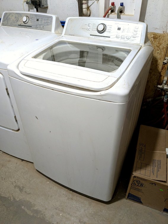 Criterion Autosensing washing machine measures 27" wide x 27" x 43" high.