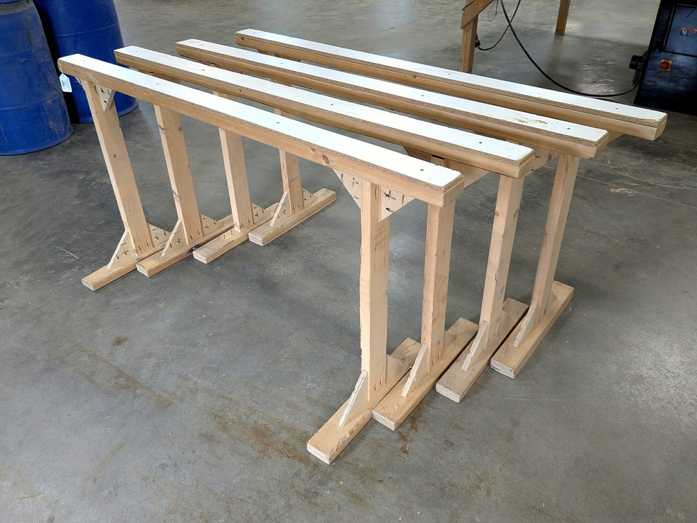 Four work shop table bases or drying stands are each 68" wide.