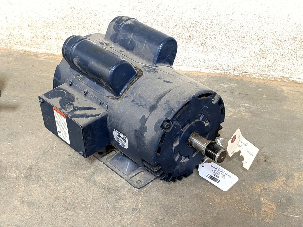 Leeson 2 hp electric motor with a 7/8" shaft and 230 volt capacity.