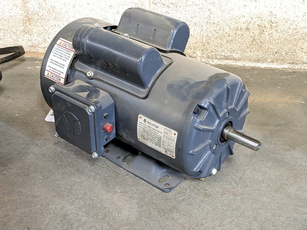 Techtop 2 hp electric motor with a 5/8" shaft and is rated 115/230 volt.