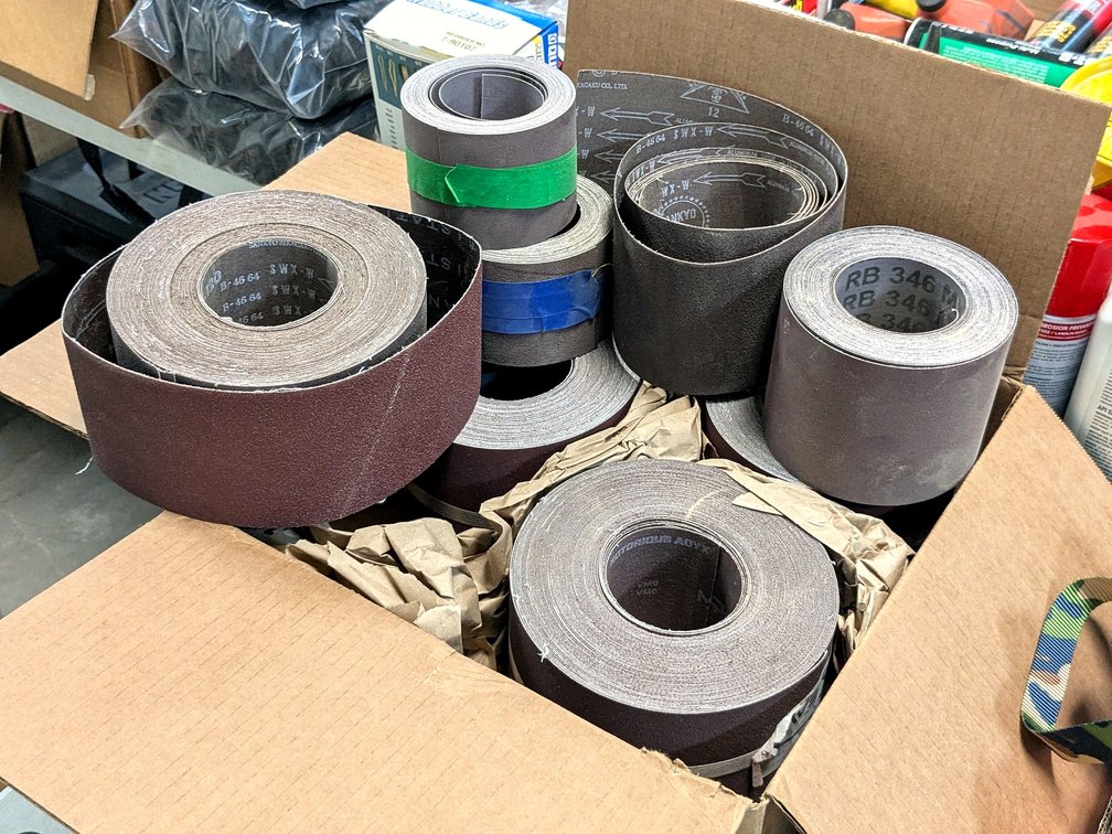 Maverick brand and other abrasive rolls, most are 4" x 25 yards and are full.