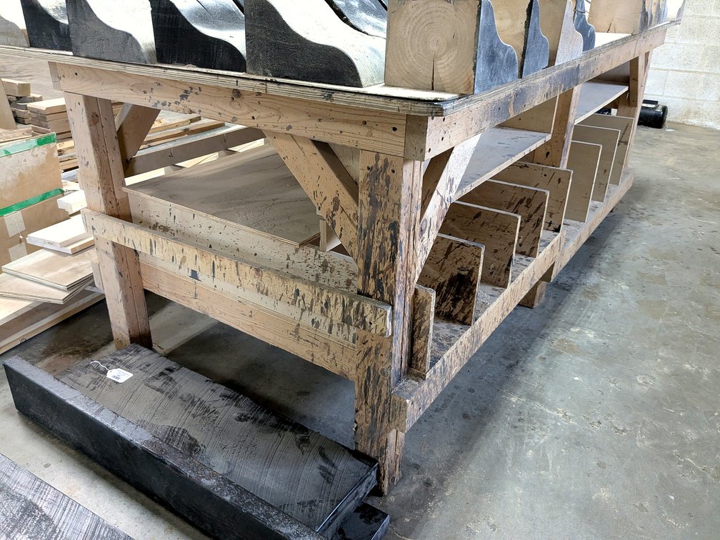 Sturdy work bench is approx. 4' x 8' x 35" high.